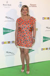 Terelu Campos con un vestido naranja con corazones
