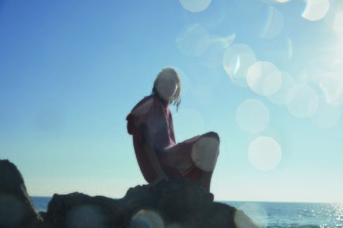 Poncho toalla de color salmón de Oysho Surf Endless Waves