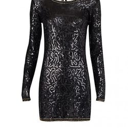 Vestido glitter negro en manga larga de Mango