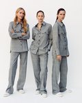 Modelos luciendo un traje gris de Mango 2019