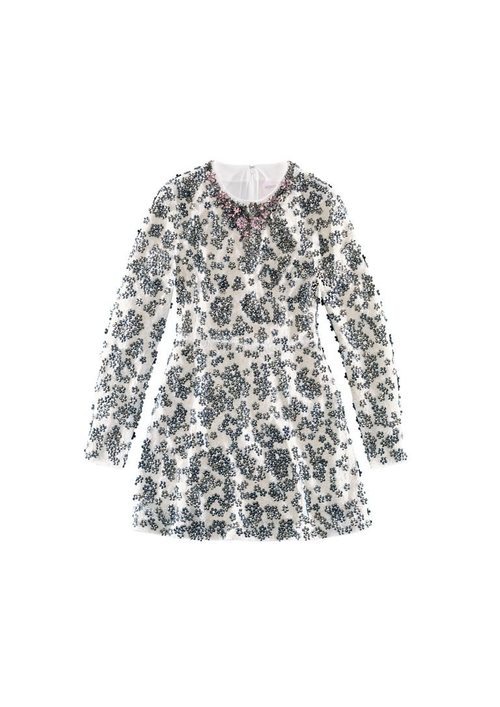 Vestido blanco con detalles florales de la colección de H&M y Giambattista Valli