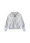Jersey gris con collar de la colección de H&M y Giambattista Valli