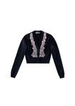 Chaqueta negra estilo torero con pedrería de la colección de H&M y Giambattista Valli