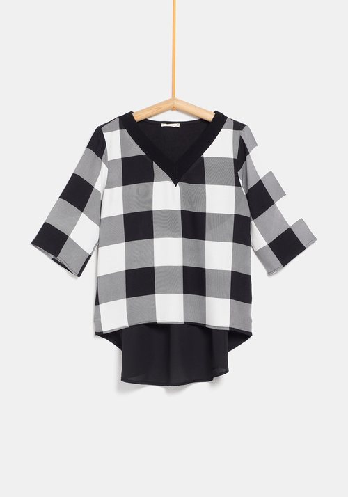 Jersey con cuadros y blusa de la colección de Rocío Osorno y TEX de otoño/invierno 2019