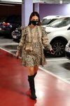 Paula Echevaría luciendo el dúo vestido y botas altas en un parking de Madrid