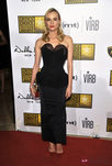 Diane Kruger con un vestido negro de Nina Ricci y clutch de Jason Wu