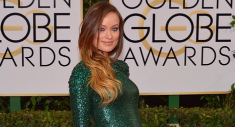 Olivia Wilde con un vestido premamá de Gucci en la alfombra roja de los Globos de Oro 2014