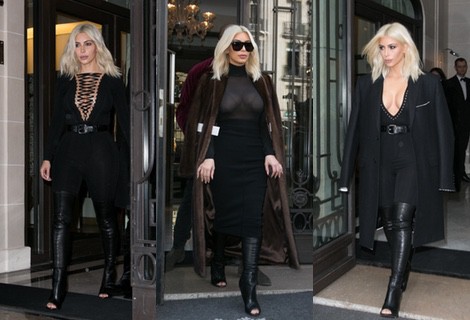 Kim Kardashian con un jumpsuit negro y botas 'peep toe' en la Paris Fashion Week