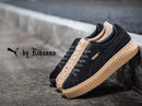 Tres zapatillas puma beige y negras de la colección 'PUMA BY RIHANNA'