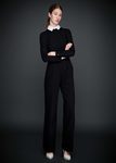 Pantalones fluidos negros y jersey de punto de la colección otoño/invierno 2015/2016 de Dolores Promesas