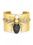 Brazalete dorado con detalle animal de la colección de joyas de BaubleBar presentada por Olivia Palermo para la Navidad 2015