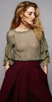 Broche plateado con detalles de rubíes de la colección de joyas de BaubleBar presentada por Olivia Palermo para la Navidad 2015