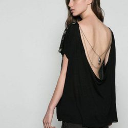 Minivestido negro con escote en la espalda de la colección Fiesta invierno 2015/2016 de Bershka