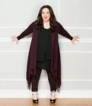 Melissa McCarthy con chaqueta fina granate y leggins en pint animal para 'Seven7'