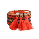 Brazalete naranja con pedrería de la colección de verano 2016 de Lola Casademunt